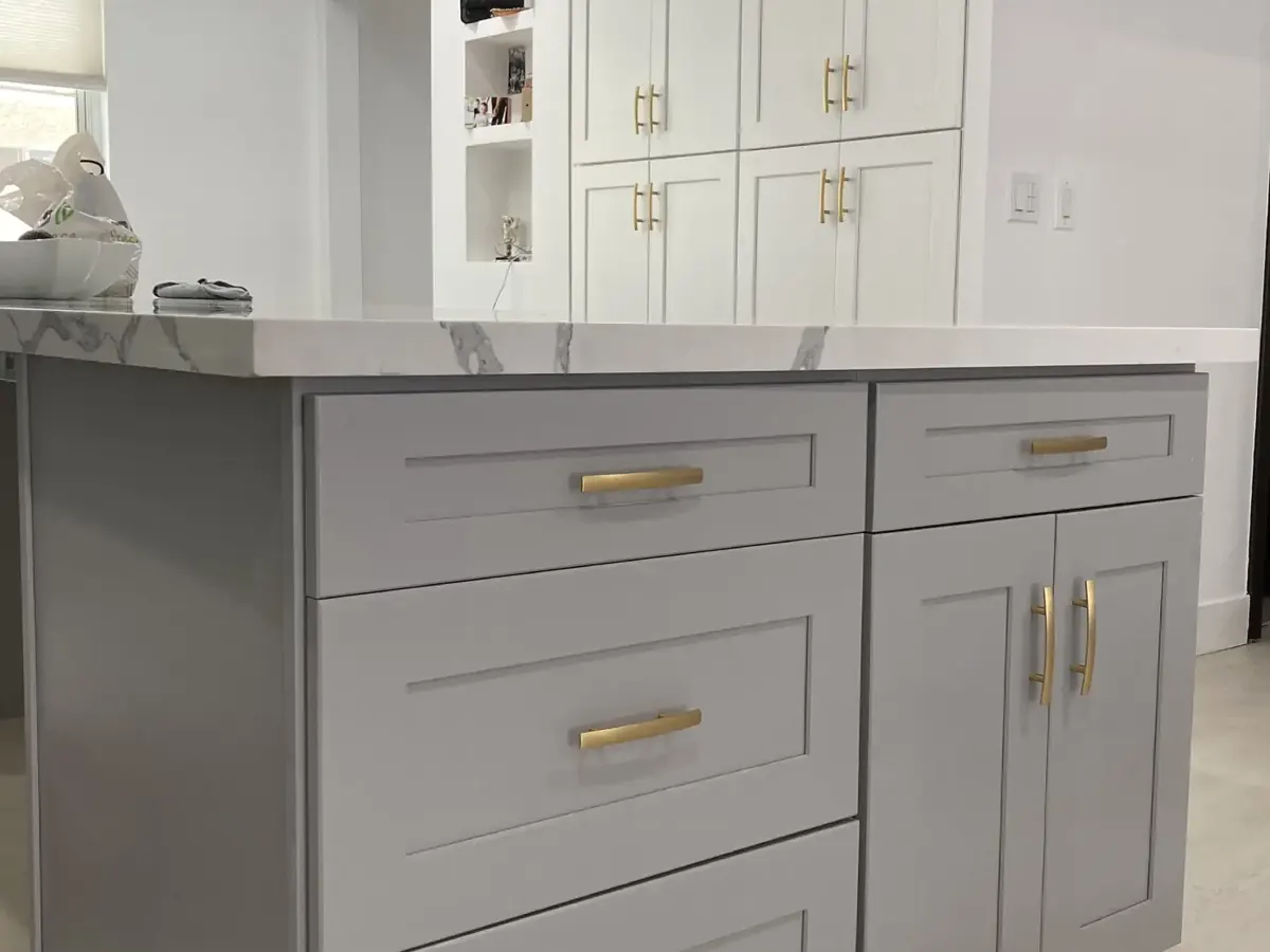 Grey shaker island with brass hardware